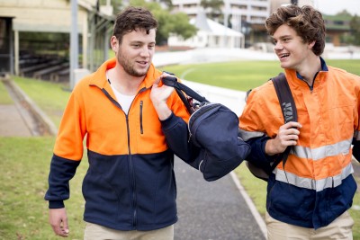 Two trade workers walking together